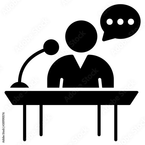 
A person standing on rostrum with microphone representing speech concept
