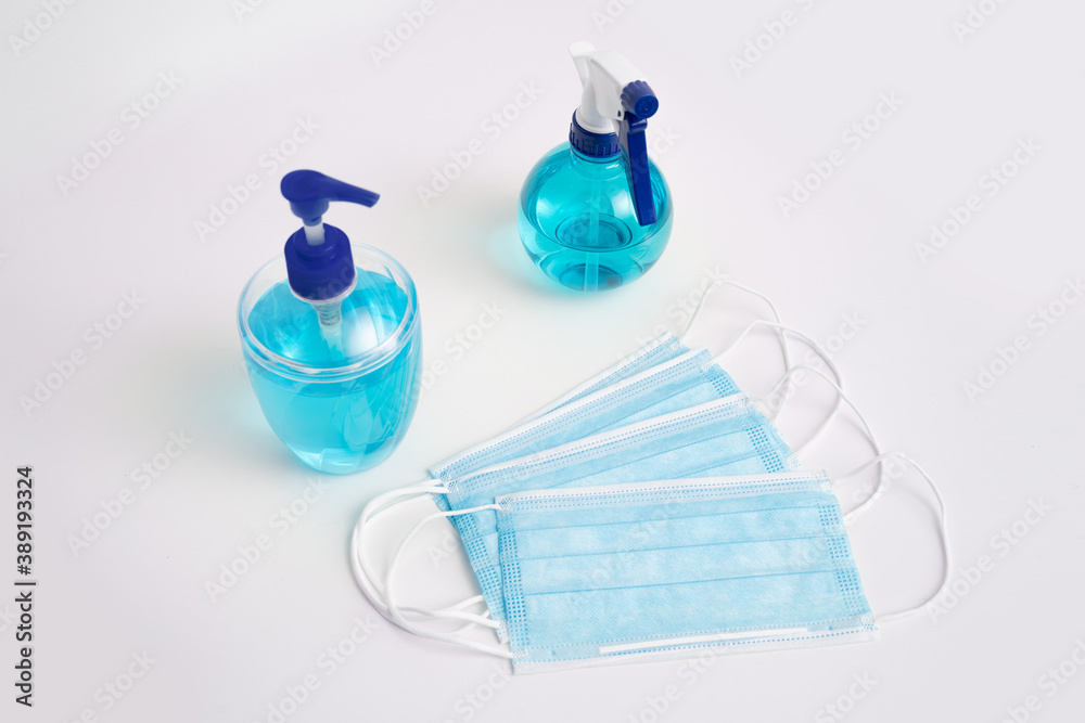 Coronavirus corona virus prevention travel surgical masks and hand sanitizer gel for hand hygiene spread protection. Coronavirus corona virus prevention travel surgical masks and hand sanitizer gel for hand hygiene spread protection.