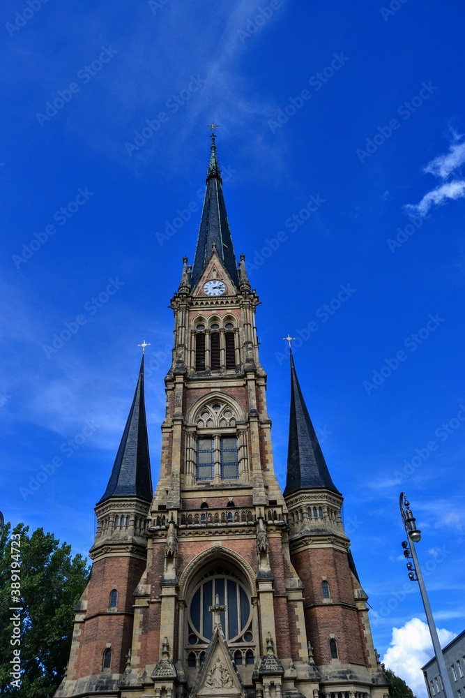Church, details of architecture and blue sky in Chemnitz. St. Peter's Church, Chemnitz (Petrikirche) Germany. During sunny day with blue sky. Church, details of architecture and blue sky in Chemnitz. St. Peter's Church, Chemnitz (Petrikirche) Germany. During sunny day with blue sky.