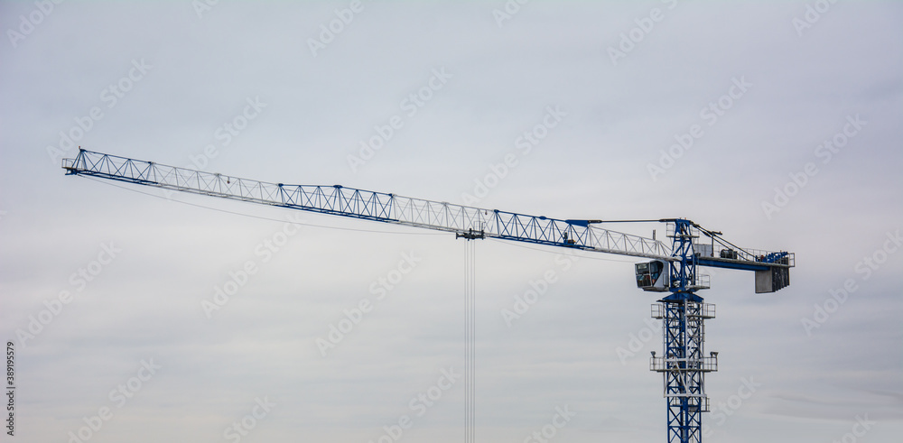 Tower crane on the background of a fading sky. Tower crane on the background of a fading sky.