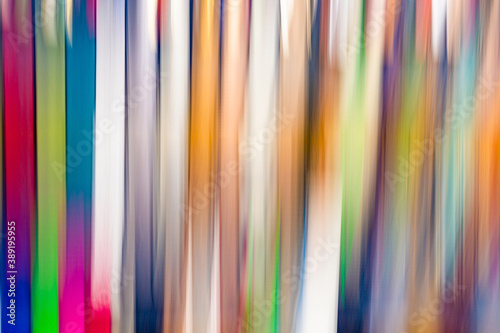 Blurred abstract background of multicolored stripes. Motion blur. Photography blur.