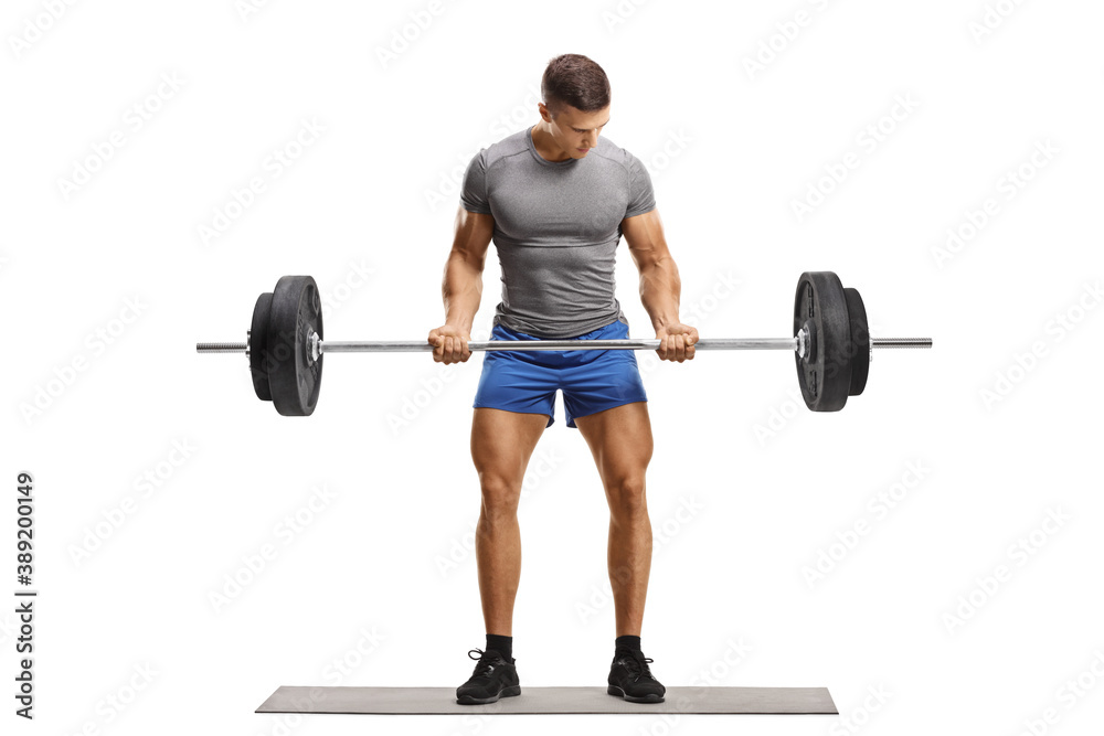Full length portrait of a muscular young man in sportswear lifting weights Full length portrait of a muscular young man in sportswear lifting weights