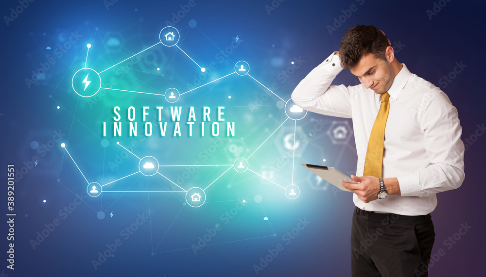 Businessman in front of cloud service icons with SOFTWARE INNOVATION inscription, modern technology concept Businessman in front of cloud service icons with SOFTWARE INNOVATION inscription, modern technology concept