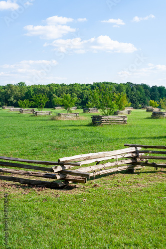 Fototapeta Naklejka Na Ścianę i Meble -  Rugged wood fences in a meadow