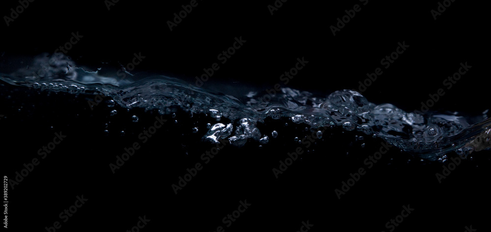 Wave of water on a black background