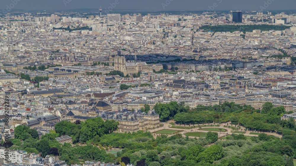 Top view of Paris skyline from above timelapse. Main landmarks of european megapolis with The Luxembourg Garden. Bird-eye view from observation deck of Montparnasse tower. Paris, France Top view of Paris skyline from above timelapse. Main landmarks of european megapolis with The Luxembourg Garden. Bird-eye view from observation deck of Montparnasse tower. Paris, France