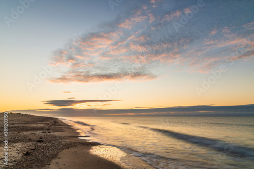 Stunning colorful sunrise over beach landscape on English South coast