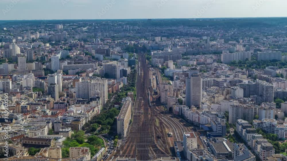 Top view of Paris skyline from above timelapse. Main landmarks of european megapolis with train station of Vaugirard-Belt. Bird-eye view from observation deck of Montparnasse tower. Paris, France Top view of Paris skyline from above timelapse. Main landmarks of european megapolis with train station of Vaugirard-Belt. Bird-eye view from observation deck of Montparnasse tower. Paris, France