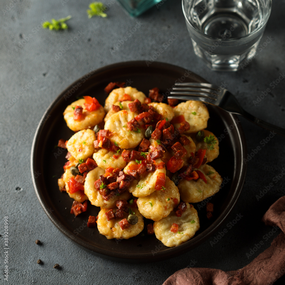 Homemade gnocchi with fried sausage and tomato Homemade gnocchi with fried sausage and tomato