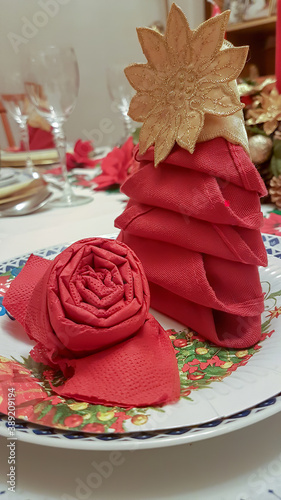 red flower-shaped napkins on Christmas table