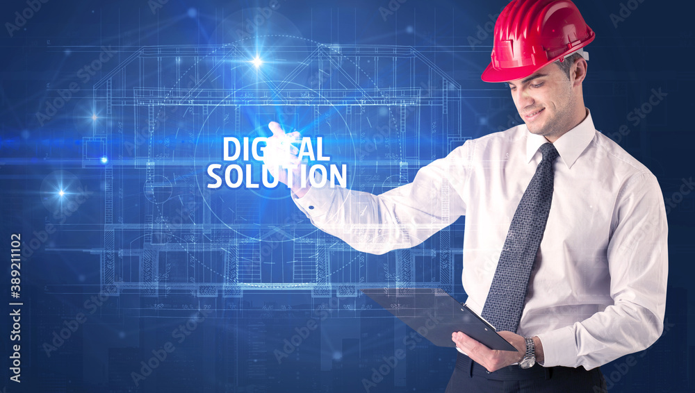 Handsome architect with helmet drawing DIGITAL SOLUTION inscription, new technology concept Handsome architect with helmet drawing DIGITAL SOLUTION inscription, new technology concept