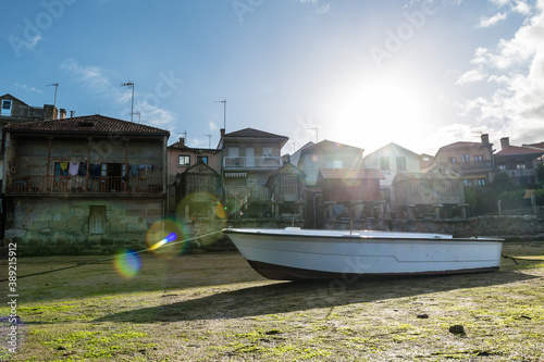 Low tide at the well-preserved village of Combarro in Ponteveda, Spain, famous for its stone cruceiros (calvaries) and horreos (raised granaries).
 photo