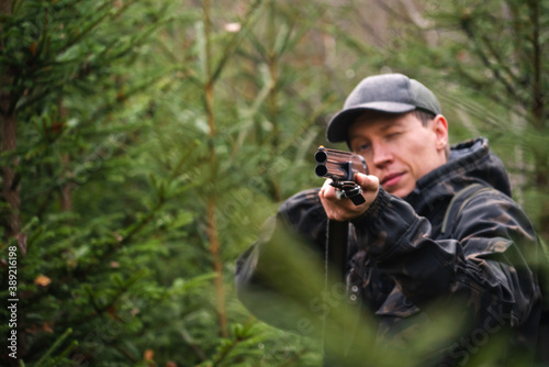 Hunter aiming a shotgun 