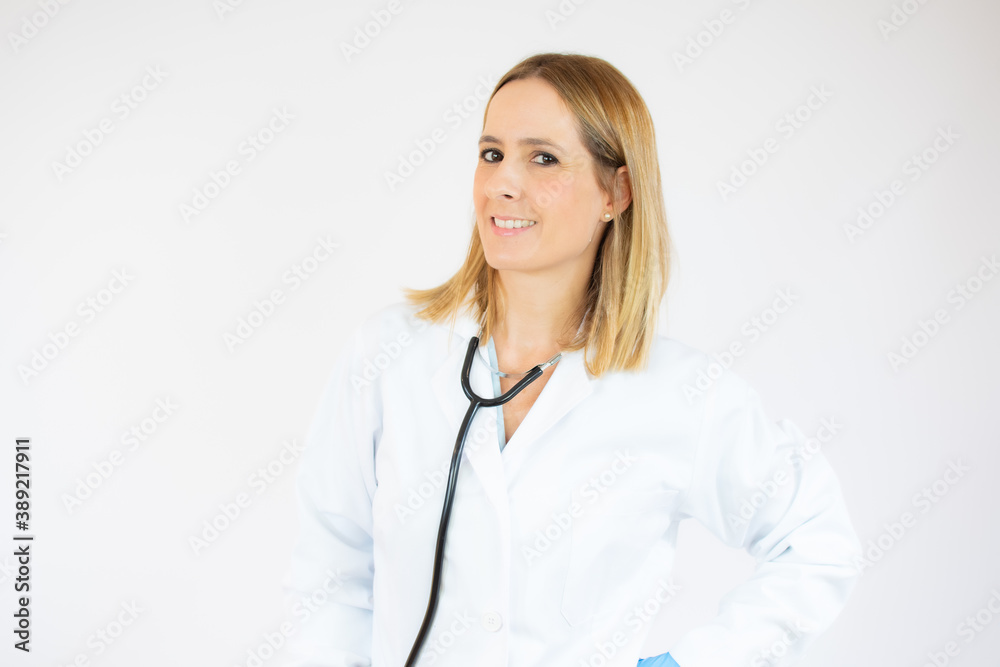 Beautiful female doctor or nurse wearing protective mask on white background with copy space. Health care concept Beautiful female doctor or nurse wearing protective mask on white background with copy space. Health care concept
