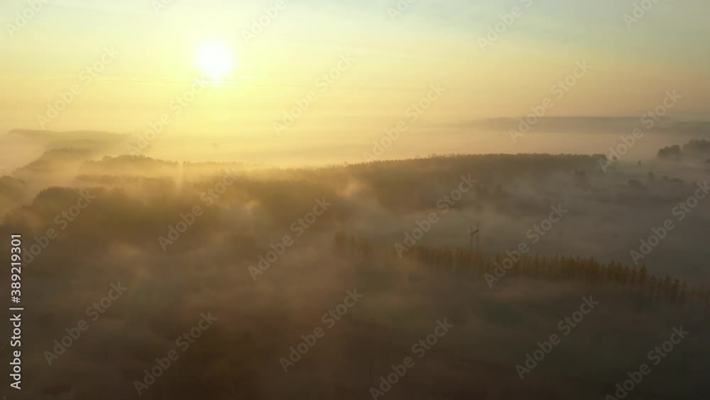 Aerial view of slowly floating vapor, steam over landscape vegetation, autumn at dawn time, sunrise. Aerial view of slowly floating vapor, steam over landscape vegetation, autumn at dawn time, sunrise.
