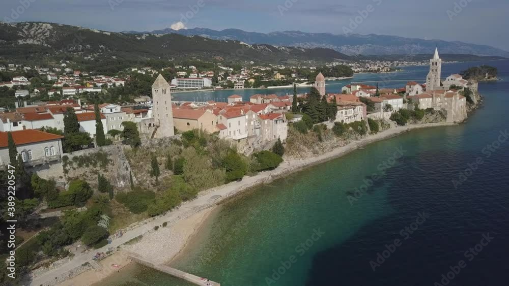 Aerial shot of historical city center of Rab island, Croatia with small beach.