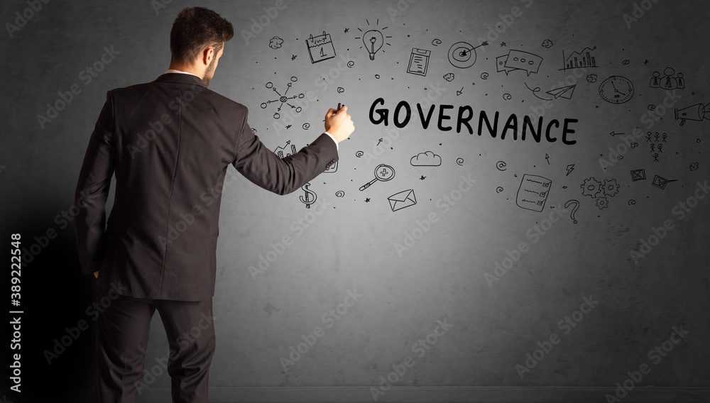 businessman drawing a creative idea sketch with GOVERNANCE inscription, business strategy concept businessman drawing a creative idea sketch with GOVERNANCE inscription, business strategy concept
