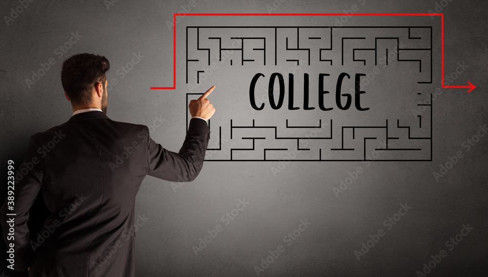 businessman drawing maze with COLLEGE inscription, business education concept businessman drawing maze with COLLEGE inscription, business education concept