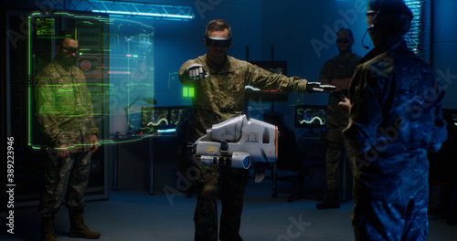 Commander controlling futuristic drone in service room