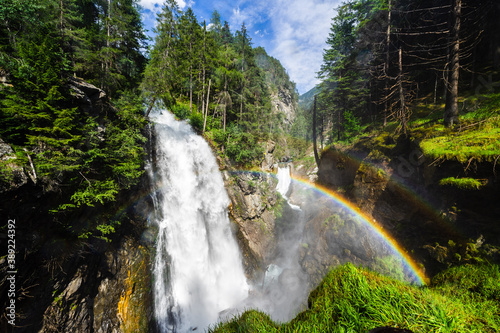 Fototapeta Naklejka Na Ścianę i Meble -   Riva waterfall and rainbow, Cascate di Riva, Reinbach-Wasserfälle, Campo Tures,  South Tyrol, DOlomites, Italy