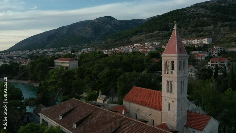 flying counter clockwise around church tower view of Bol on Brac Island Croatia flying counter clockwise around church tower view of Bol on Brac Island Croatia