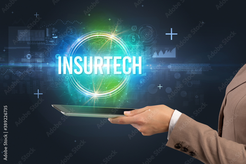 Close-up of a touchscreen with INSURTECH inscription, new technology concept Close-up of a touchscreen with INSURTECH inscription, new technology concept
