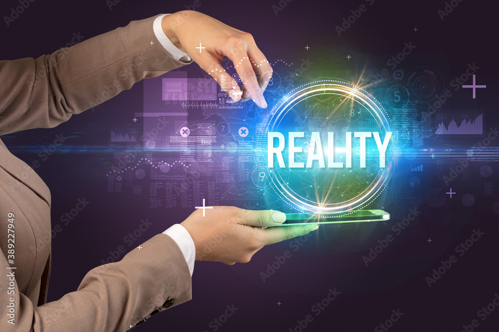Close-up of a touchscreen with REALITY inscription, new technology concept Close-up of a touchscreen with REALITY inscription, new technology concept