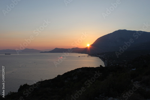 Fotografie, Obraz Sunset over the beautiful beaches of the Greek island of Samos in the Aegean Sea