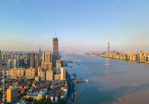 Aerial view of Wuhan skyline and Yangtze river with supertall skyscraper under construction in Wuhan Hubei China. © AS_SleepingPanda