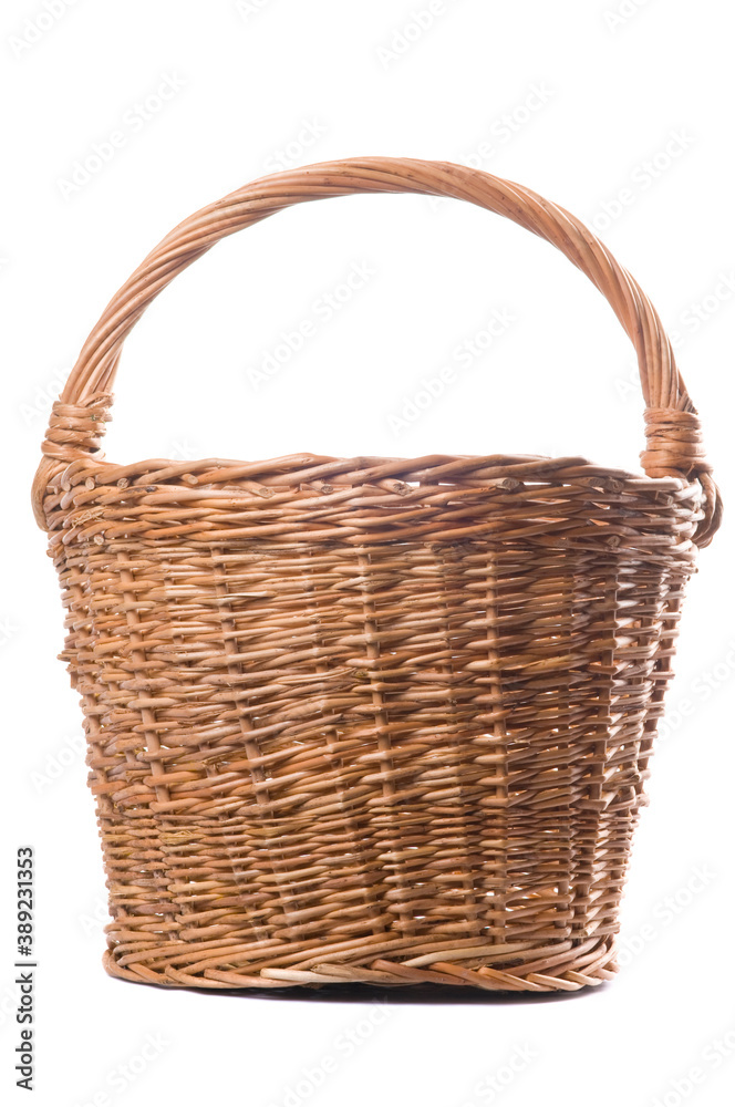 Empty Wicker Basket Isolated on White Background. Traditional craftsman made rounded brown wicker basket. Studio shot