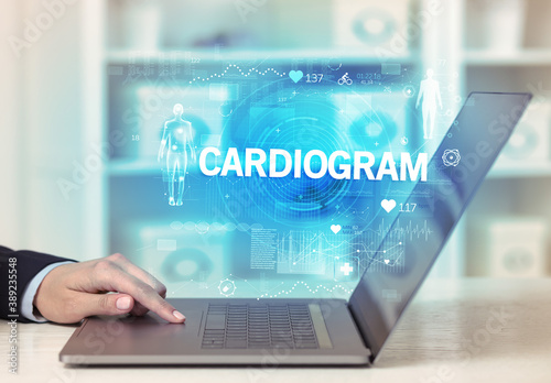 Doctor working a health check with CARDIOGRAM inscription, recording medical test results