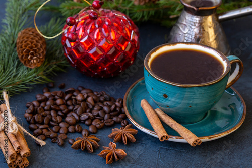 A cup of coffee on the background of New Year's decorations. Celebrating Christmas and New Years.