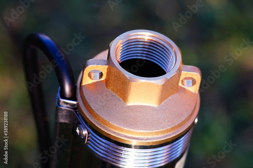 The top of the well pump with black cable. The outlet thread of the downhole pump.