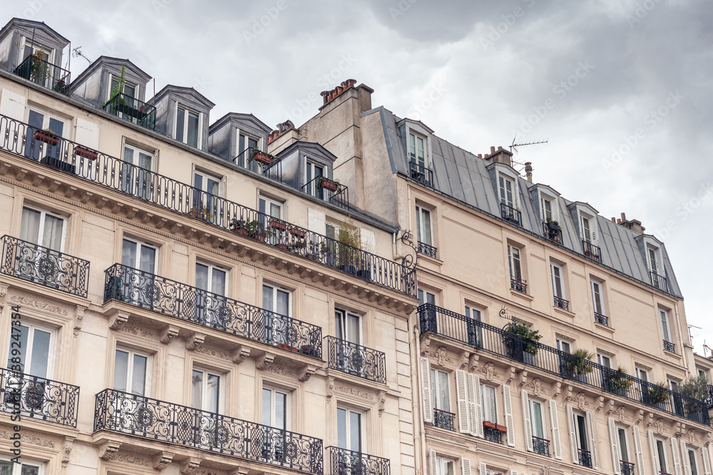 Beautiful Paris building facade with windows and balconies
