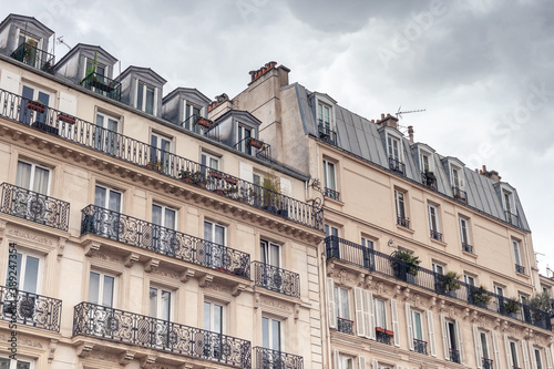Beautiful Paris building facade with windows and balconies © Lizzy Komen