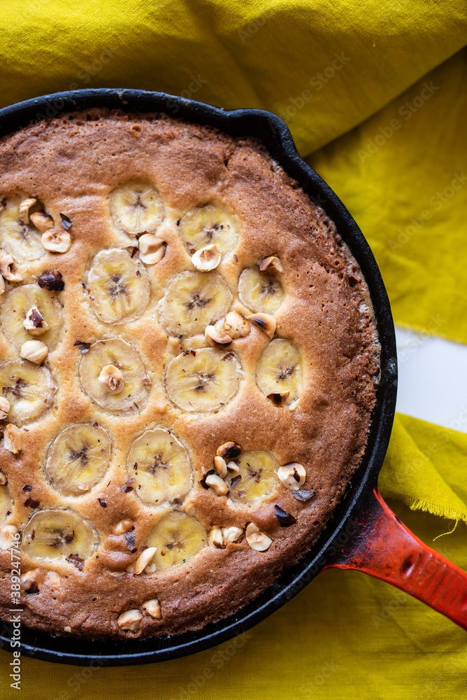 Skillet banana and hazelnuts cookie, baked in a cast iron pan