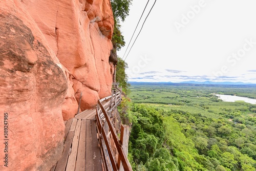 Wooden Walkway Along Cliffs of Wat Phu Tok in Bueng Kan Province photo