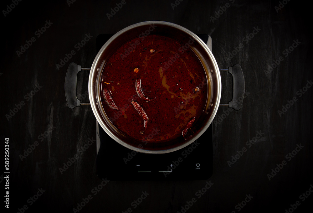 Fotografie Mala shabu soup on a black background