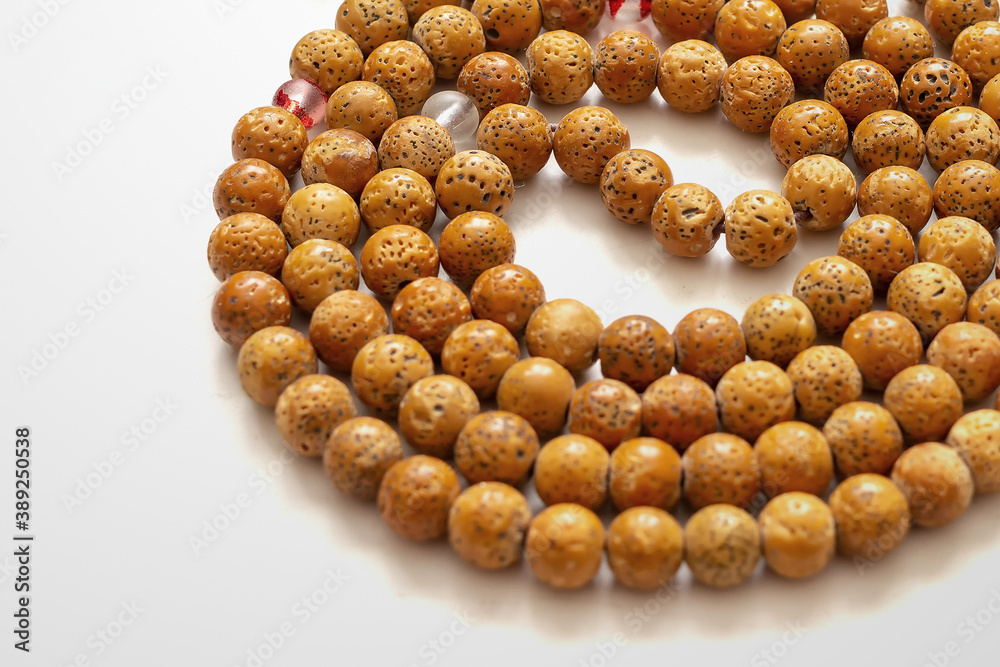 Buddhist prayer beads on white