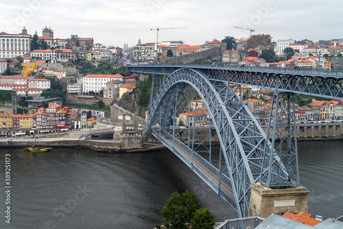Dom Luis iron bridge crossing the Douro river in Porto, Portugal © catuncia