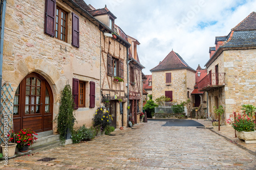 countryside town of stone houses in france © jon_chica
