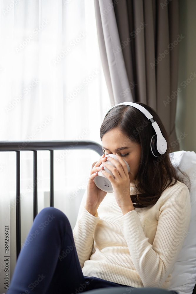 Asian woman relaxing in the room. Asian woman relaxing in the room.