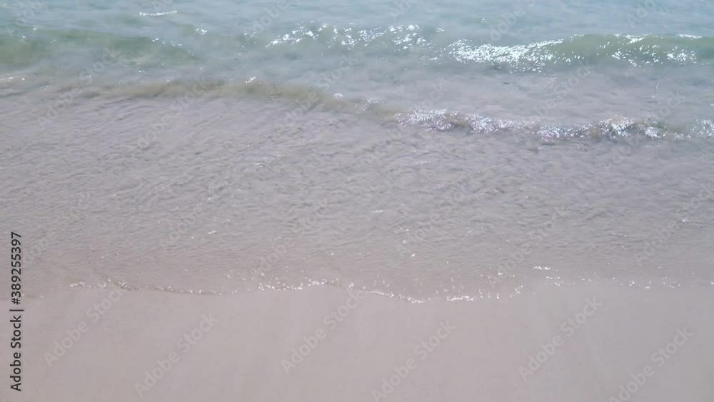 Sparkling sea waves on the sand Sparkling sea waves on the sand