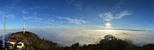 Panorama from the sea of fog from the Uetliberg on a beautiful autumn day. With television tower