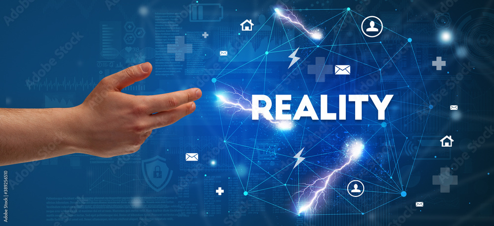 Hand pointing at REALITY inscription, modern technology concept Hand pointing at REALITY inscription, modern technology concept