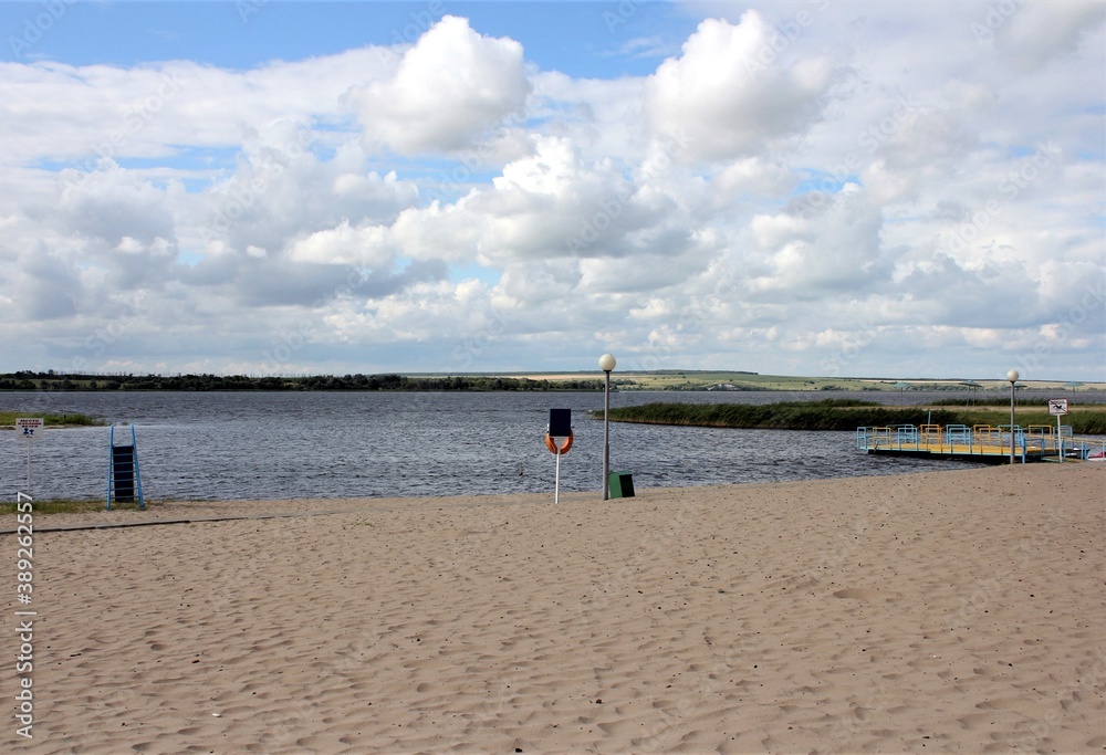 A deserted beach on a cool summer day. Translation of the inscription: 