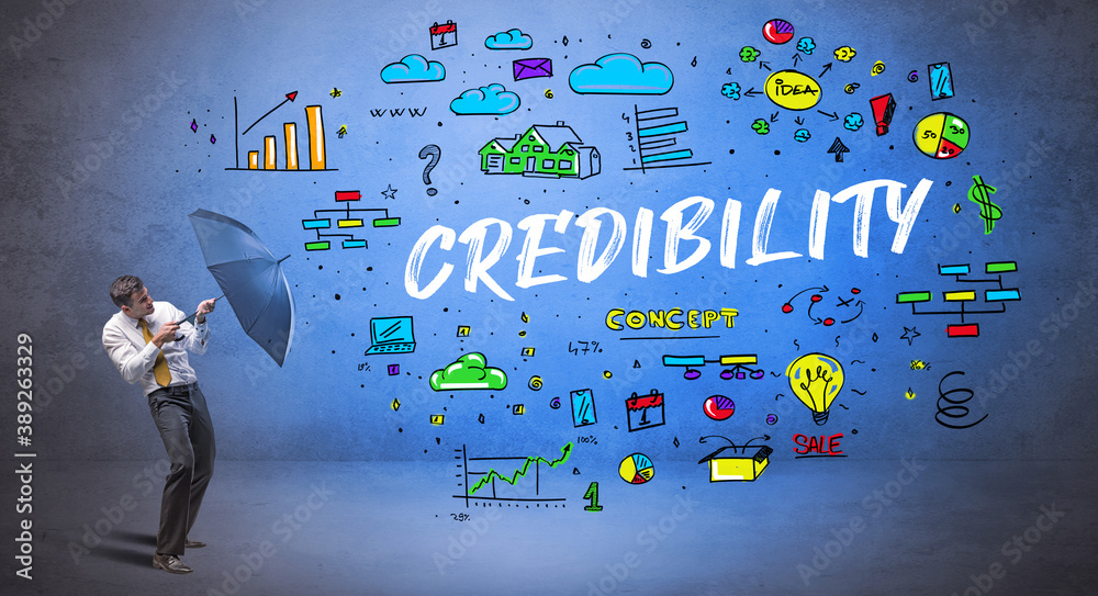 Determined businessman hiding behind umbrella with CREDIBILITY inscription, new business concept Determined businessman hiding behind umbrella with CREDIBILITY inscription, new business concept