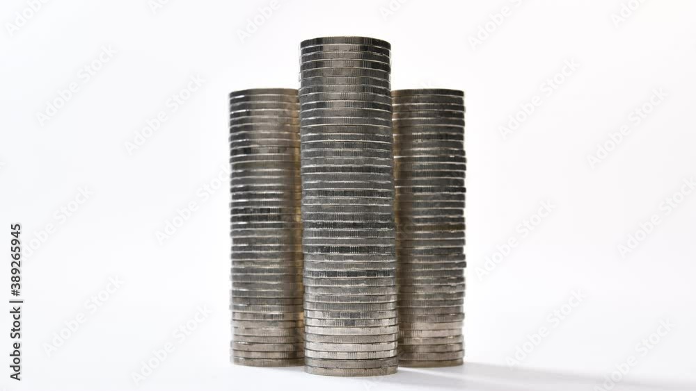 Coins on stack increasing on white background - stop motion Coins on stack increasing on white background - stop motion
