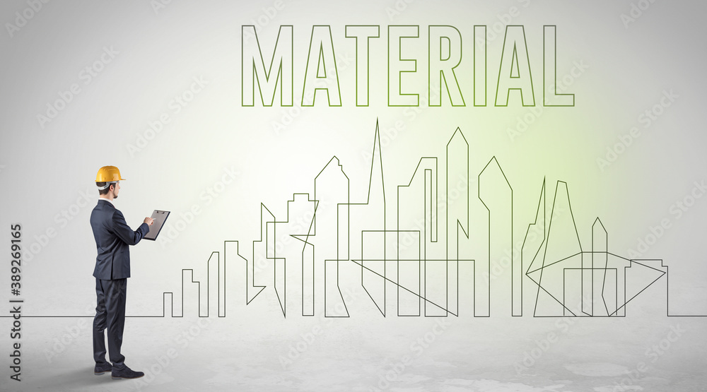 Businessman in hard hat holding blueprint with MATERIAL inscription, engineering and architecture concept Businessman in hard hat holding blueprint with MATERIAL inscription, engineering and architecture concept