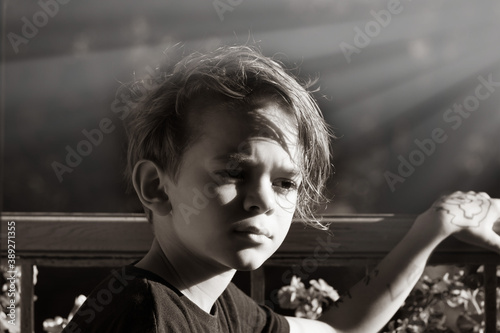 Portrait image of a little boy on the balcony photo